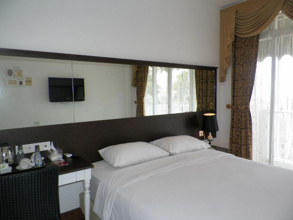 The Victoria Guesthouse Bandung Pokoj fotografie